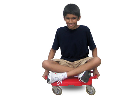 Boy sitting cross legged on a red turbo gym scooter